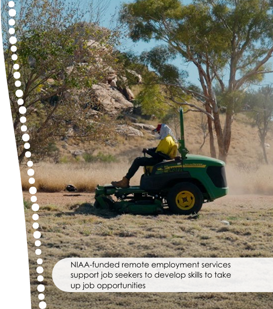 A man on a lawn mower cutting grass