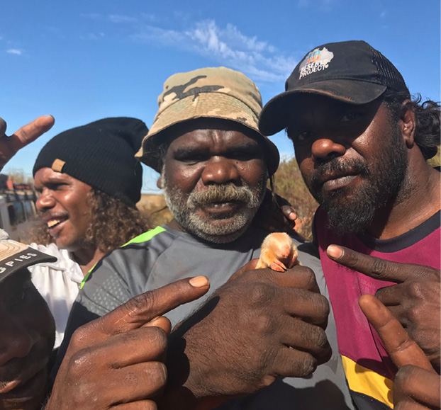 Kiwirrkurra Rangers holding a Northern marsupial mole